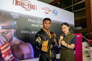 Thai kickboxer Buakaw Banchamek (left) and Ms. Thapanee Kiatphaibool, TAT Executive Director of Tourism Products Department (right) at recent press launch of the “Awesome Muay Thai” directory.