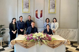 Mr. Jonathan Wigley (left), CEO of Absolute Hotel Services, sits with Ms Peachaya Pitaksit, Managing Director of Dream D Company Limited, during the management contract signing for U Hua Hin.