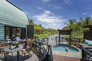  The One-Bedroom Lagoon Spa Villa features an outdoor deck and pool, perched above the rippling lagoon.