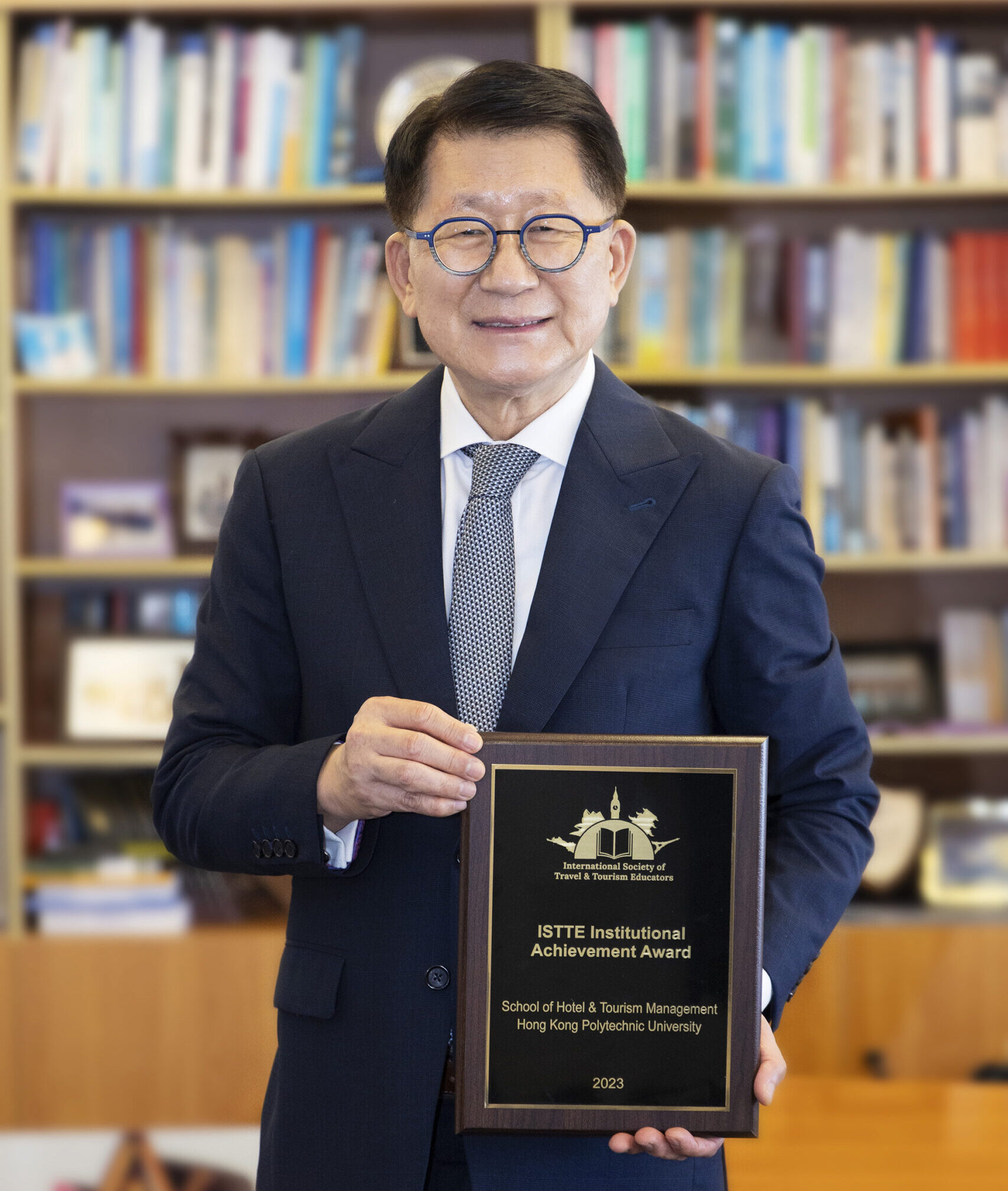 SHTM Dean Kaye Chon with the 2023 ISTTE Institutional Achievement Award