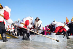 Workers collect ice from the Songhua River in Harbin, capital of northeast China's Heilongjiang Province.
