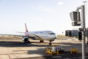 A plane of China's Hainan Airlines is seen at the Auckland International Airport for a direct flight from south China's Haikou to Auckland in New Zealand.