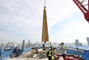 The original property’s signature golden spire was returned as part of the new hotel’s topping-off ceremony