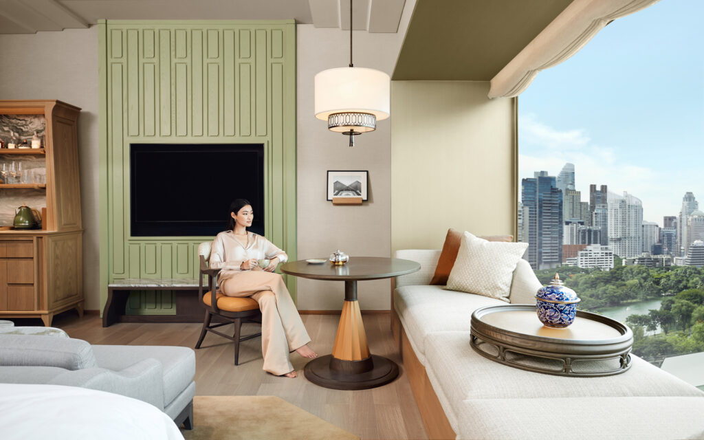 dusit-thani-bangkok-guestroom-deluxe-lounge-lifestyle.jpeg