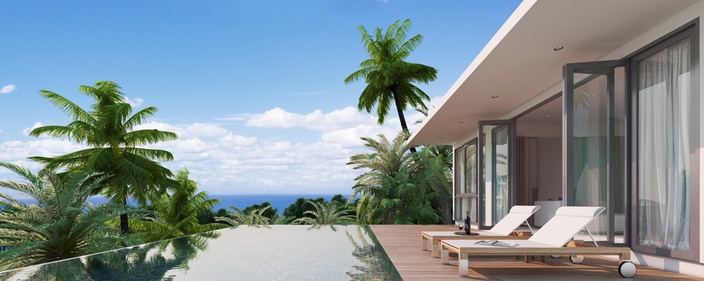 Elevated luxury pool villa sanctuaries are surrounded by tropical rainforest, overlooking Karon Beach